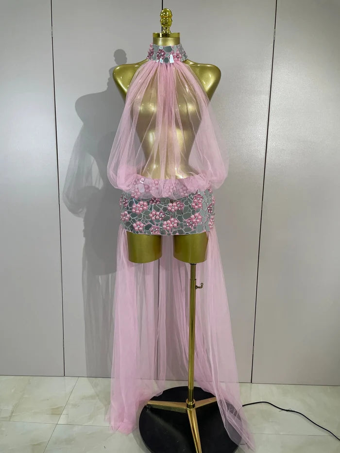 Make a grand entrance in the Almira rhinestone pearl mirror mesh long-tail dress. Luxury sheer gown for parties, stage, and special events.