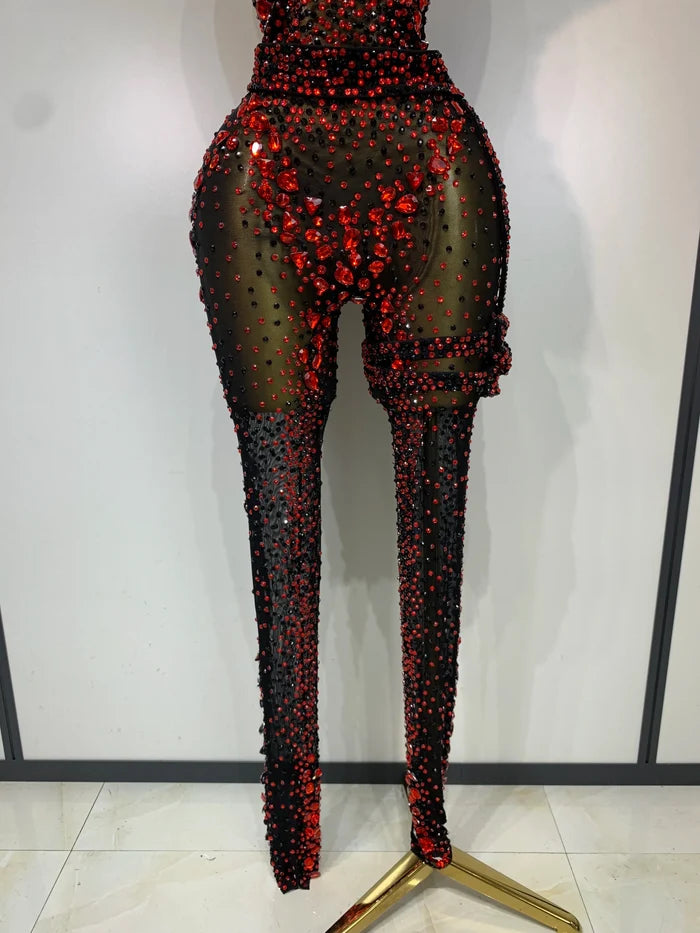 Turn heads in the Amanda backless red rhinestone black mesh jumpsuit. Sparkly bodycon outfit for stage performances, parties, and birthdays.