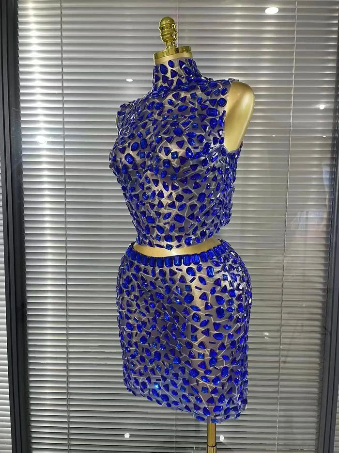 Amber crystal mesh two piece bodycon mini dress set for women. Sexy outfit for nightlife, stage wear, and party events.