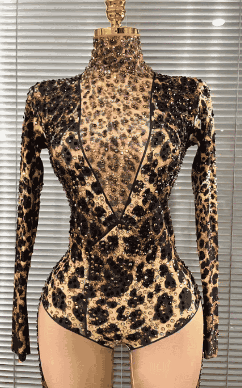 Azi leopard print rhinestone two piece performance outfit for women. Sexy clubwear for stage, DJ sets, and nightlife events.