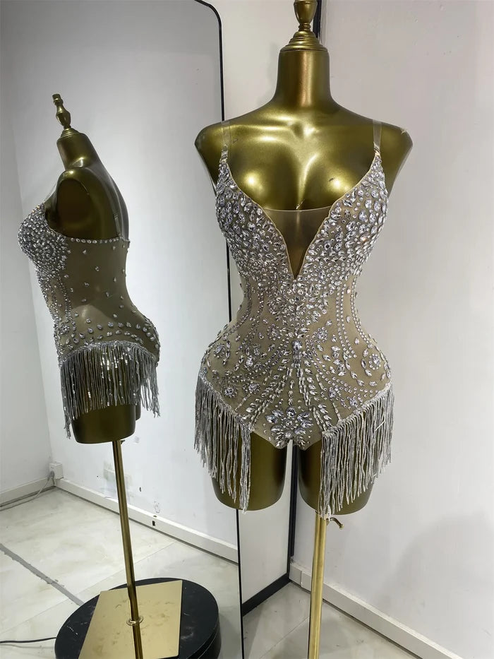 Shine in the Bridgette red rhinestone tassel mesh bodysuit. Glamorous stage outfit for performances, birthdays, parties, and nightclub events.