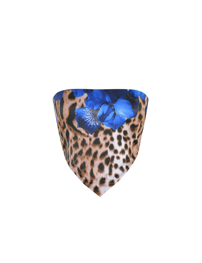 A TIGERMIST BRIXLEY TOP - MULTI : LEOPARD featuring a leopard print and blue floral design. The smooth, triangular fabric combines the wild pattern of animal spots with the vibrant contrast of bright blue flowers, creating a striking and stylish look.