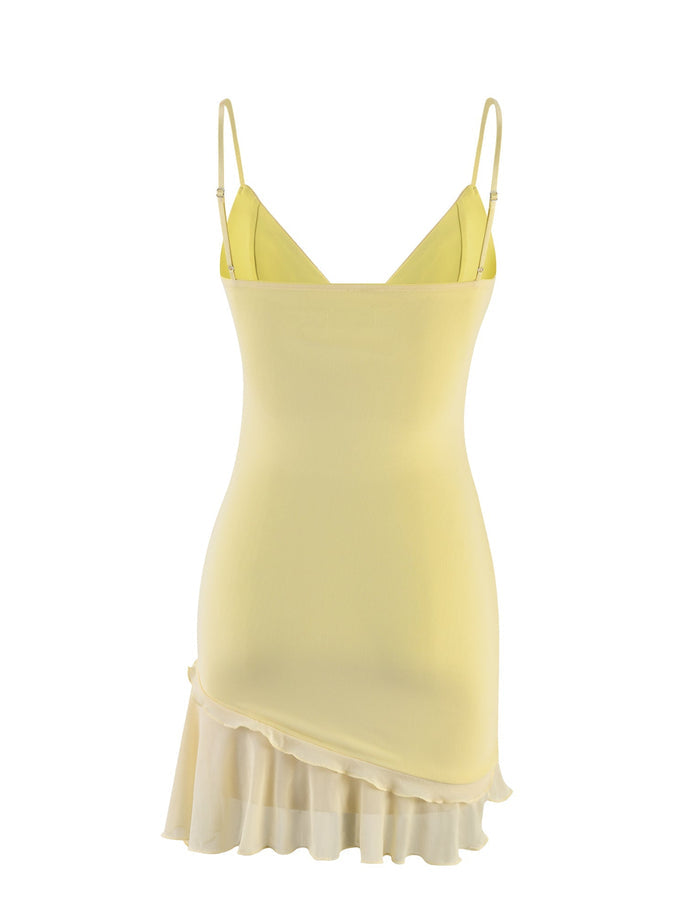 A yellow Lemon Carly Dress from TIGERMIST with spaghetti straps, a fitted bodice, and a flared asymmetrical hemline featuring layered ruffles. The fabric appears light and slightly sheer. The dress is shown against a plain white background.