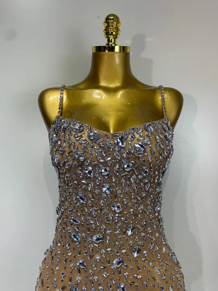 Cassandra sleeveless rhinestone bodycon mini dress for women. Sexy sparkly outfit for birthdays, nightlife, and stage wear.