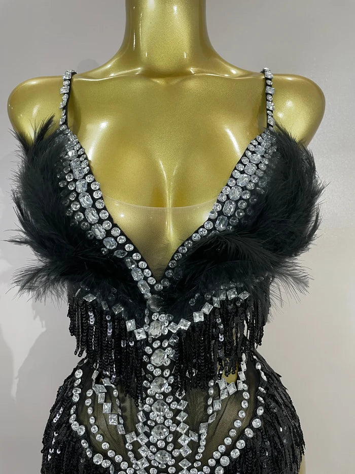 Claire rhinestone feather tassel mesh bodysuit for women. Sexy performance outfit for nightlife, dance, and stage events.