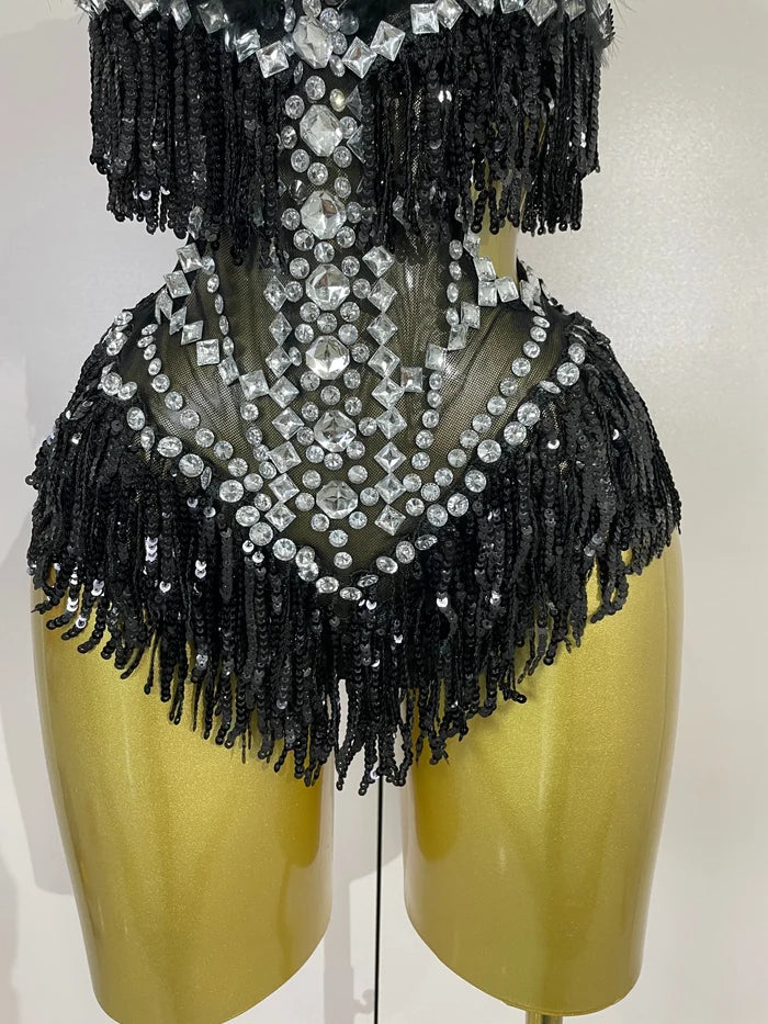 Claire rhinestone feather tassel mesh bodysuit for women. Sexy performance outfit for nightlife, dance, and stage events.