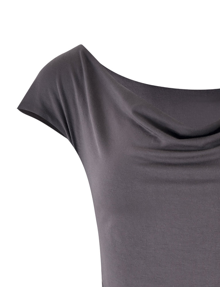 Close-up of the COBI JERSEY TANK - GREY : STEEL GREY from TIGERMIST, a short-sleeved top with a draped cowl neckline. The soft and smooth fabric creates gentle folds at the upper chest area. Only part of the front and shoulder of this elegant top is visible.