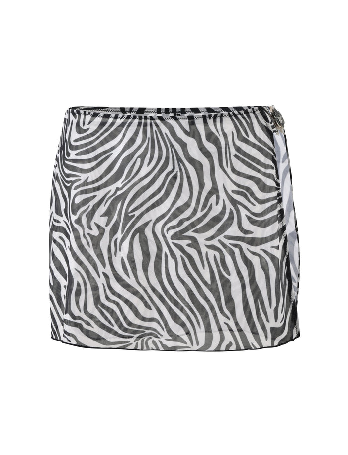 Check out the TIGERMIST Cynthia Mini Mesh Skirt in Black Zebra, a chic short skirt featuring a bold black and white zebra print design. This stylish wrap-around skirt has a slight overlap on one side with a buckle detail at the top for added flair. Made from lightweight, semi-sheer fabric, it's perfect for any fashionable outfit.