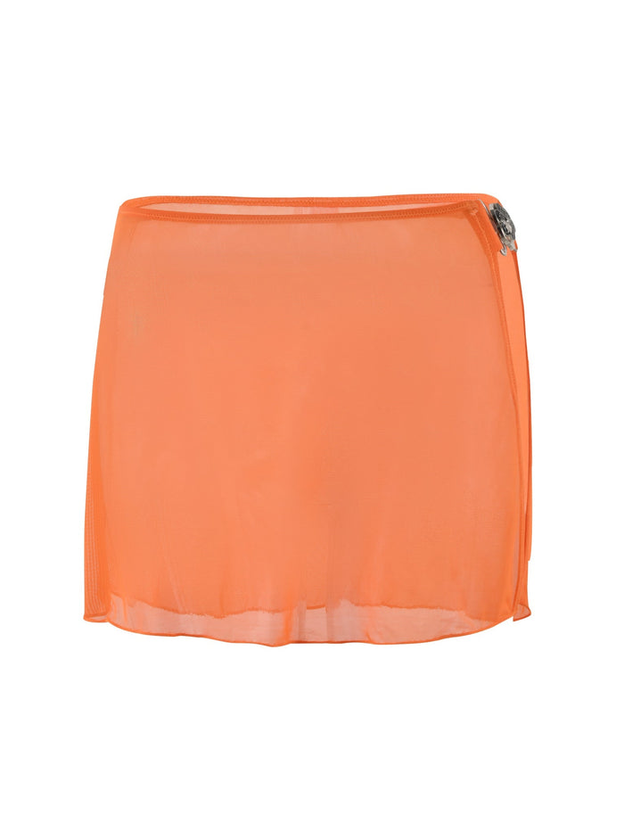 The CYNTHIA MINI MESH SKIRT - ORANGE : BURNT ORANGE from TIGERMIST is an orange, sheer mini skirt with a slight A-line cut. It features a small decorative clasp on the left side near the waistband and has a subtly curved hem with an almost translucent appearance.