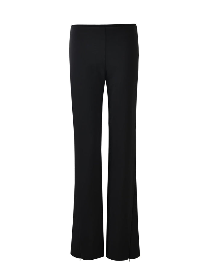 The DAMIRA PANT - BLACK by TIGERMIST is showcased against a white background. These high-waisted pants have a straight-leg design that fits snugly at the hips and thighs, with a slight flare towards the bottom.