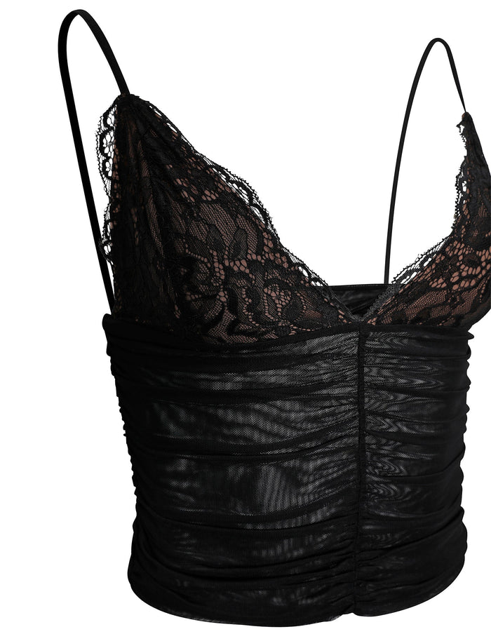 The DEENA TOP - BLACK from TIGERMIST showcases a fitted lace camisole design with thin straps and a ruched bodice. Its floral lace pattern over a sheer mesh layer gives the top a delicate and elegant appearance.