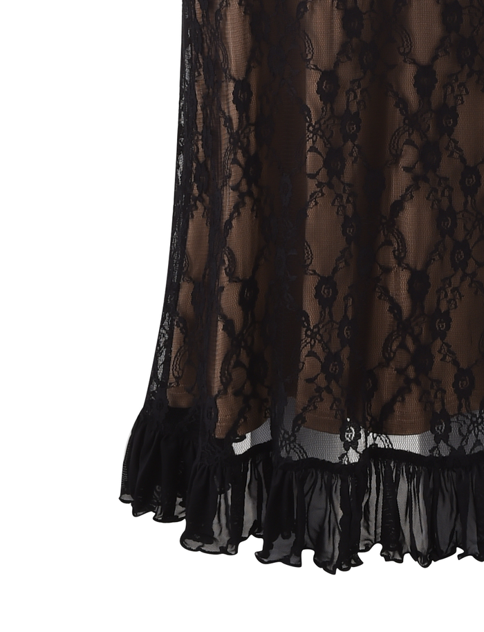 Close-up of the TIGERMIST DEJA DRESS - BLACK: a lace midi dress featuring a floral pattern, sheer fabric with partial lining, and a ruffled hem that subtly reveals skin beneath the intricate black lace.