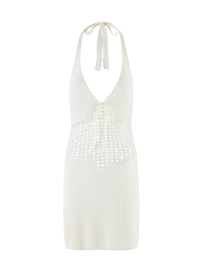 The DELTA MINI DRESS by TIGERMIST is a sleeveless white crochet dress with a halter neckline, neck tie, openwork midsection, V-neckline, open back detail, and underbust tie.