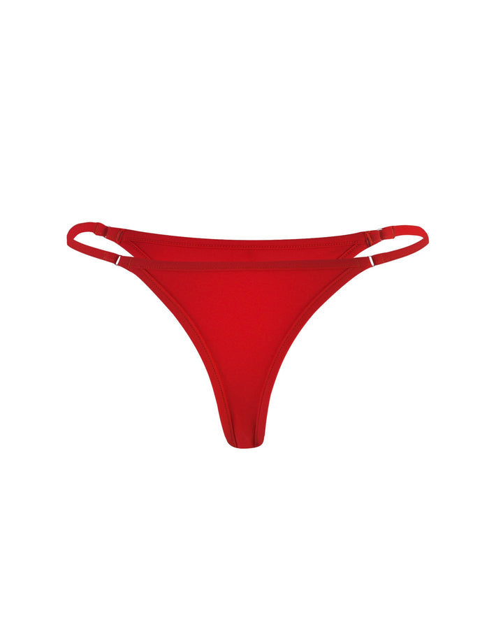 Product Description: The DIANA BIKINI BOTTOM - RED from TIGERMIST features a chic V-shaped front and double side straps, offering a streamlined and minimalistic design for a stylish yet comfortable fit. Displayed against a white background, this red bikini bottom is perfect for elevating your swimwear collection.