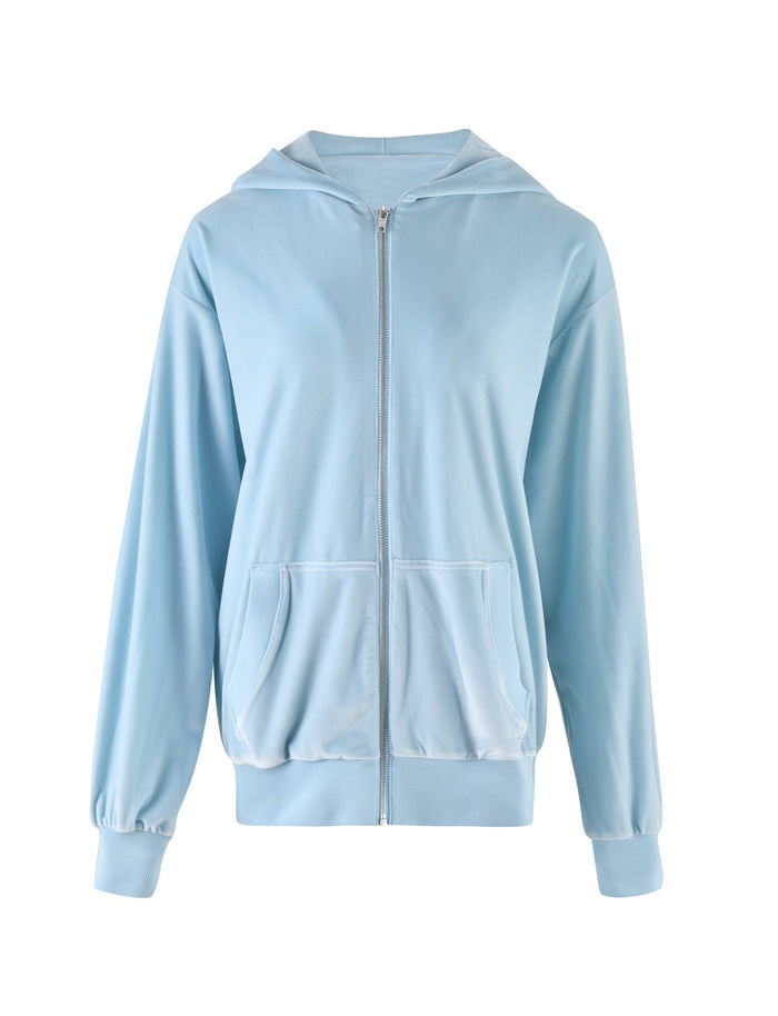 The ERICKA HOODIE - BLUE : BABY BLUE from TIGERMIST is a light blue hoodie featuring a front zipper and two front pockets. It has long sleeves with ribbed cuffs, a ribbed hem, and is made of soft, comfortable fabric.