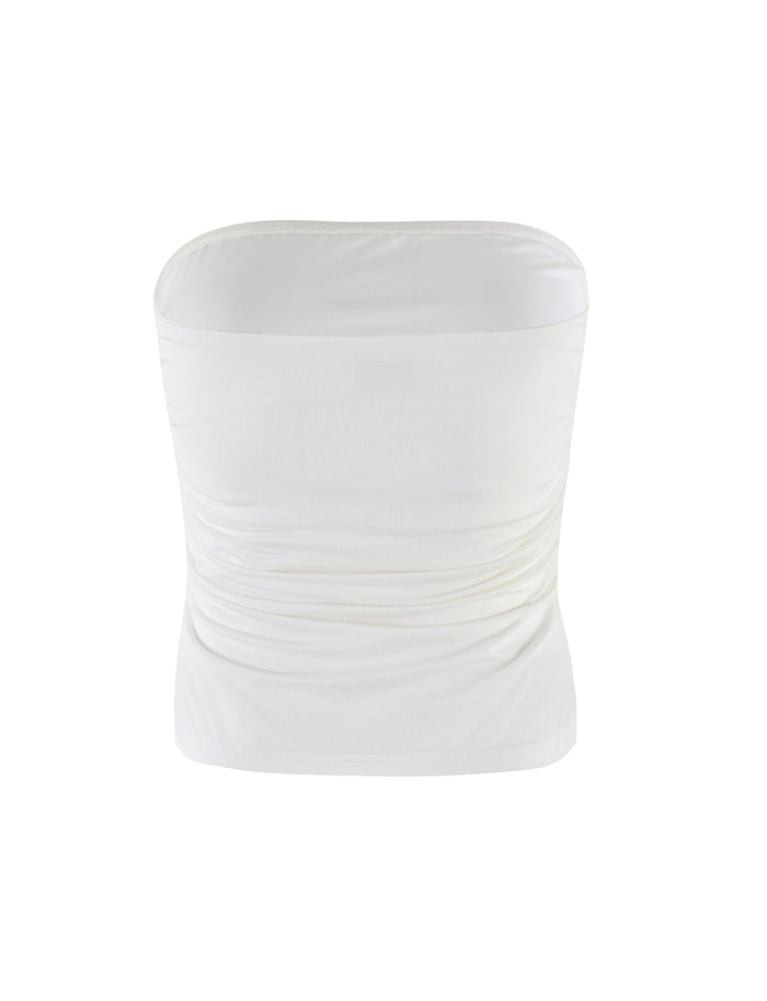 The HARRIETT JERSEY TUBE TOP in white from TIGERMIST features a snug, strapless design with a slightly ruched texture on the sides. The smooth, stretchy fabric delivers a sleek and minimalistic look that's signature to the brand's style.