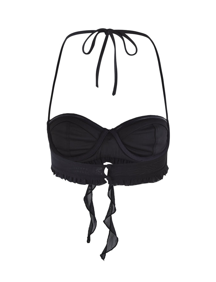 The HEAVEN TOP - BLACK by TIGERMIST is a stunning black halter-neck bikini top that features a twisted front design and keyhole detail. It comes with adjustable straps, ruffled trim accents, and a tie closure at the back, all enhanced with hints of mesh fabrication for added allure.