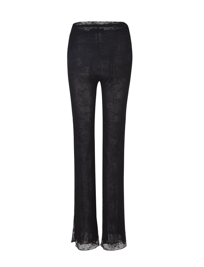 The INAYAH PANT - BLACK by TIGERMIST is displayed against a white background. These semi-sheer pants feature a slight flare at the bottom and intricate lace detailing throughout, offering an elegant and stylish appearance.