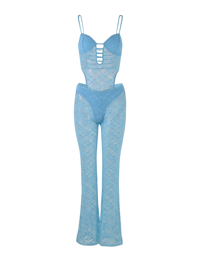 The INZA JUMPSUIT - BLUE by TIGERMIST is a stunning baby blue lace jumpsuit featuring a strappy bust, spaghetti straps, and a see-through lace design that extends into full-length pant legs. The midsection and legs are sheer and adorned with intricate floral lace patterns throughout.