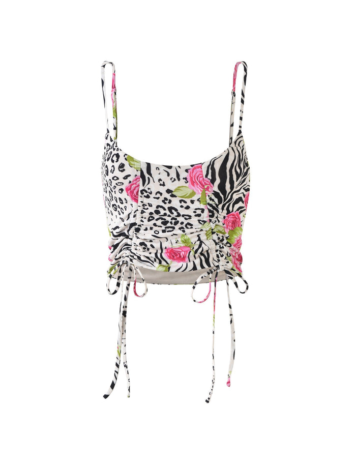 The IRIE TOP - MULTI : ZEBRA by TIGERMIST is a cropped tank top with thin shoulder straps, featuring a striking combination of zebra and leopard patterns, accented with pink roses. The top includes side drawstrings to create a stylish ruched effect and showcases a color palette of black, white, green, and pink.