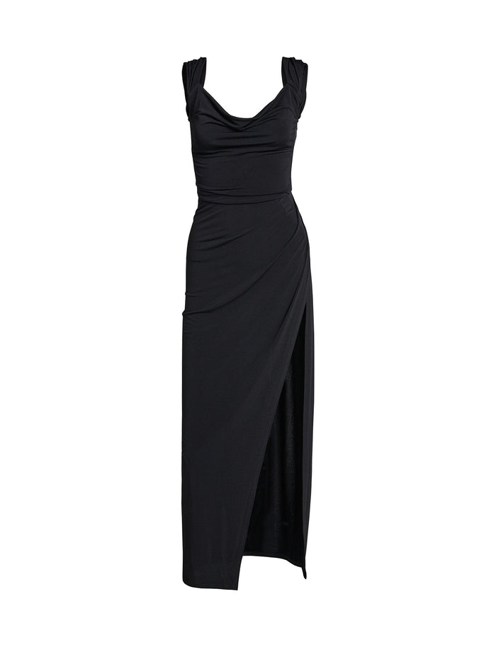 The JOSLIN MAXI DRESS by TIGERMIST is a black sleeveless evening gown featuring a draped neckline and ruched detailing on the sides. This sophisticated dress showcases a fitted silhouette with an asymmetrical hemline, creating a high slit on one side. The soft, flowing fabric makes it the perfect choice for an elegant night out.