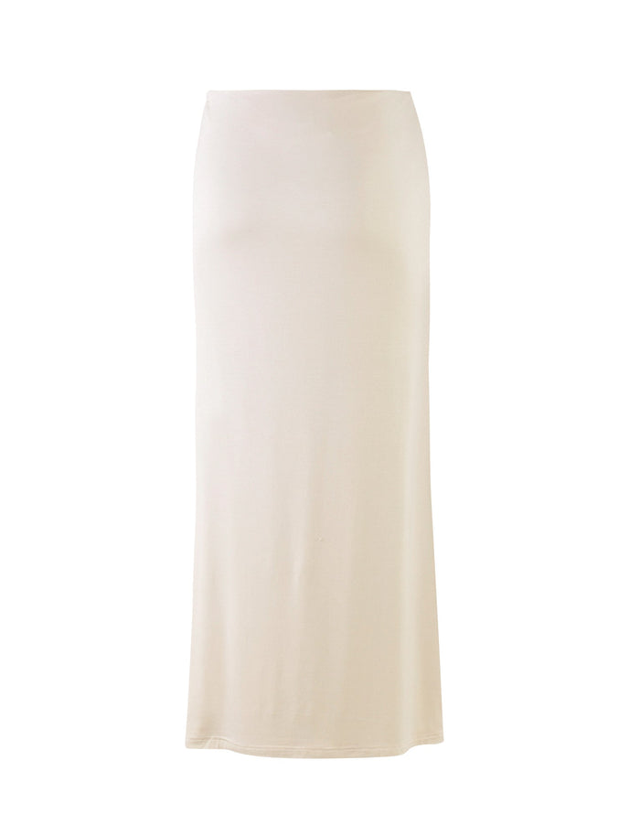 The Karolina Jersey Skirt from TIGERMIST, in a sleek off-white ivory shade, features a long, straight silhouette with a fitted waist and minimal detailing. Its smooth appearance and simple, elegant design fall to ankle-length, making it versatile for various occasions.