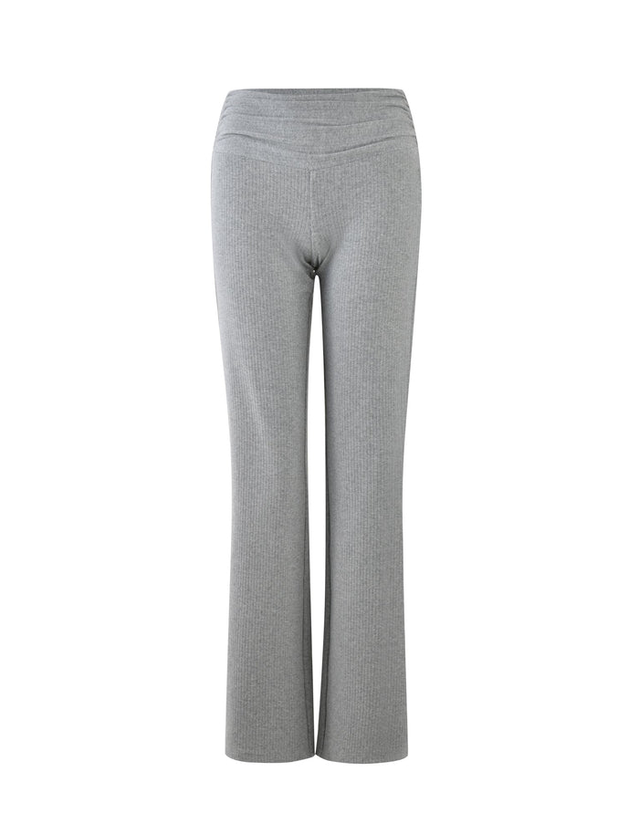 Dove Grey high-waisted pants with a flared leg design from TIGERMIST, pictured from the front against a white background. The fabric appears to be soft and ribbed, giving a textured look. The waistband is seamless for a smooth appearance.