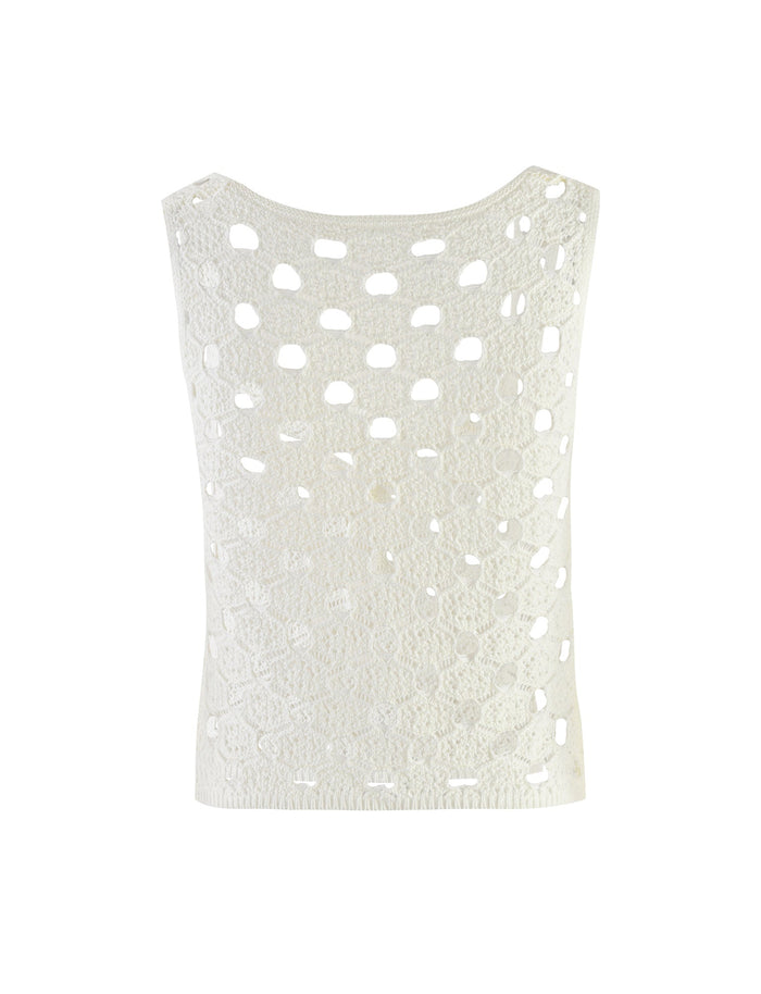The Kincade Top by TigerMist is a white, sleeveless crocheted garment featuring an intricate and airy design with a variety of patterns and holes. The fabric showcases both larger and smaller open spaces, giving it a lightweight appearance.