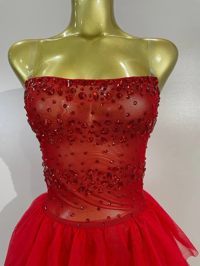 Turn heads in the Laura red rhinestone strapless mesh mini dress. Sexy bodycon party dress for birthdays, clubs, cocktail parties, and events.