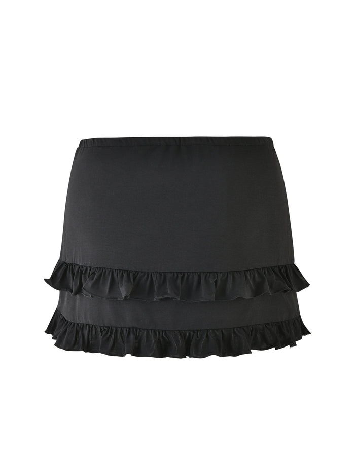 The LEOLA SKIRT - BLACK from TIGERMIST is an above-the-knee skirt featuring an elastic waistband and dual layers of ruffled trim near the hemline. Crafted from a lightweight, slightly stretchy fabric, it offers both comfort and freedom of movement. This design by Tiger Mist combines simplicity with style, making it ideal for casual or semi-formal events.