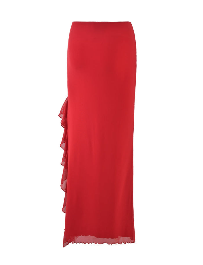 The LINETTE SKIRT - RED by TIGERMIST is a vibrant red, high-waisted maxi skirt featuring an asymmetrical ruffle cascading down the left side. It boasts a floor-length design with a sleek, elegant silhouette, perfectly embodying TIGERMIST's signature style.