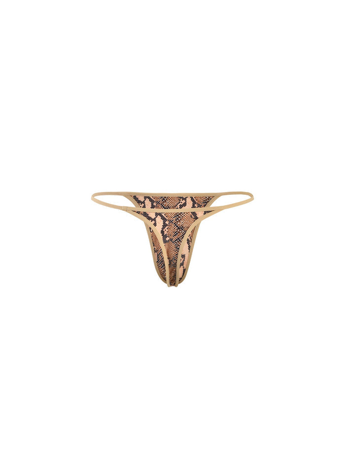 The LULA BIKINI BOTTOM by TIGERMIST is a skimpy thong-style underwear featuring a beige and brown snakeskin design, with a beige waistband and edges.