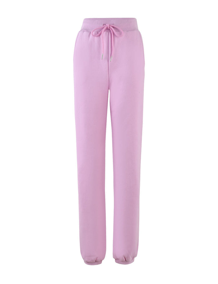 Introducing the LUMEN PANT - PINK by TIGERMIST: This pair of light pink loungewear pants features an elastic waistband and drawstring. These mid-rise sweatpants offer a relaxed fit with gathered cuffs at the ankles, making them ideal for cozy days.