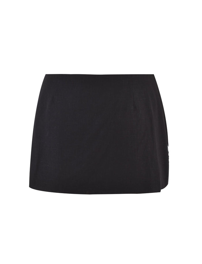 A sleek, lightweight black mini skirt by TIGERMIST with a simple, clean design. The MAISHA SKIRT - BLACK features a slightly fitted silhouette and no visible patterns or embellishments.