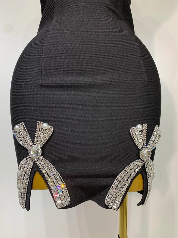 Mary V neck beaded black mini bandage dress for women. Elegant luxury party outfit for clubs, birthdays, and evening events.