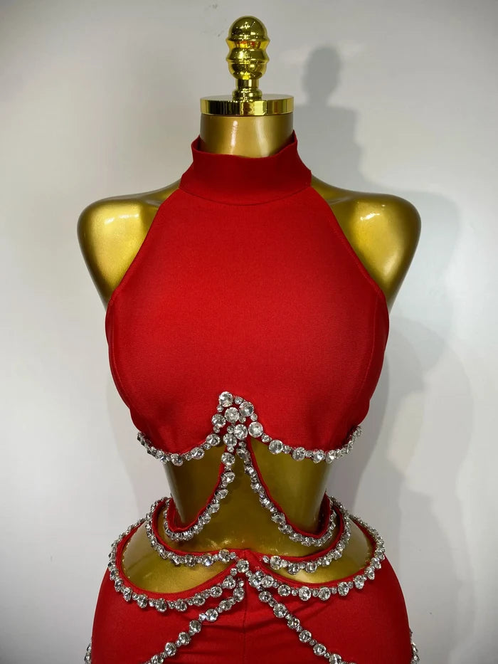 Stand out in the Meghan red rhinestone cut-out bandage pants set. Sexy two-piece outfit for birthdays, parties, clubs, and special occasions.