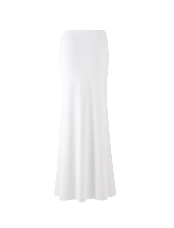 The MIST SKIRT - WHITE from TIGERMIST is a floor-length, pure white A-line skirt with smooth, flowing fabric. It features a high waist and a simple, elegant design, making it perfect for formal or semi-formal occasions.