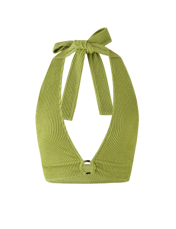 The NEERA TOP - GREEN by TIGERMIST is a lime green halter top crafted from textured, ribbed fabric. It boasts a deep V-neckline and fastens with a bow knot at the back of the neck. This sleeveless top has a slightly cropped length.