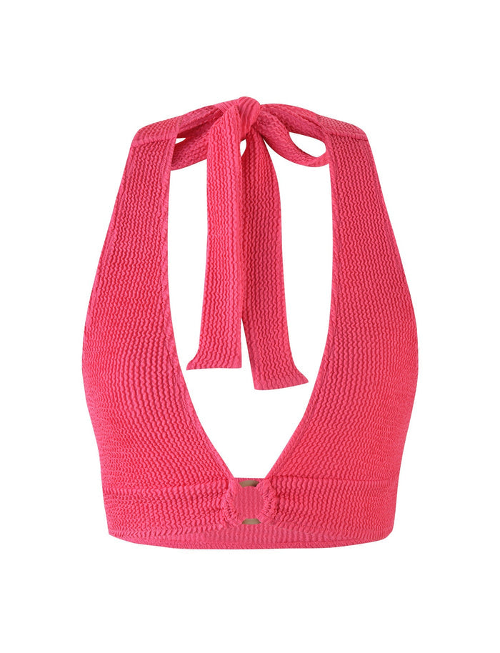 The NEERA TOP by TIGERMIST, available in vibrant hot pink fuchsia, is a halter-style bikini top featuring a textured fabric. It includes thick straps that tie at the neck, a plunging neckline, and a clasp closure at the center of the back.
