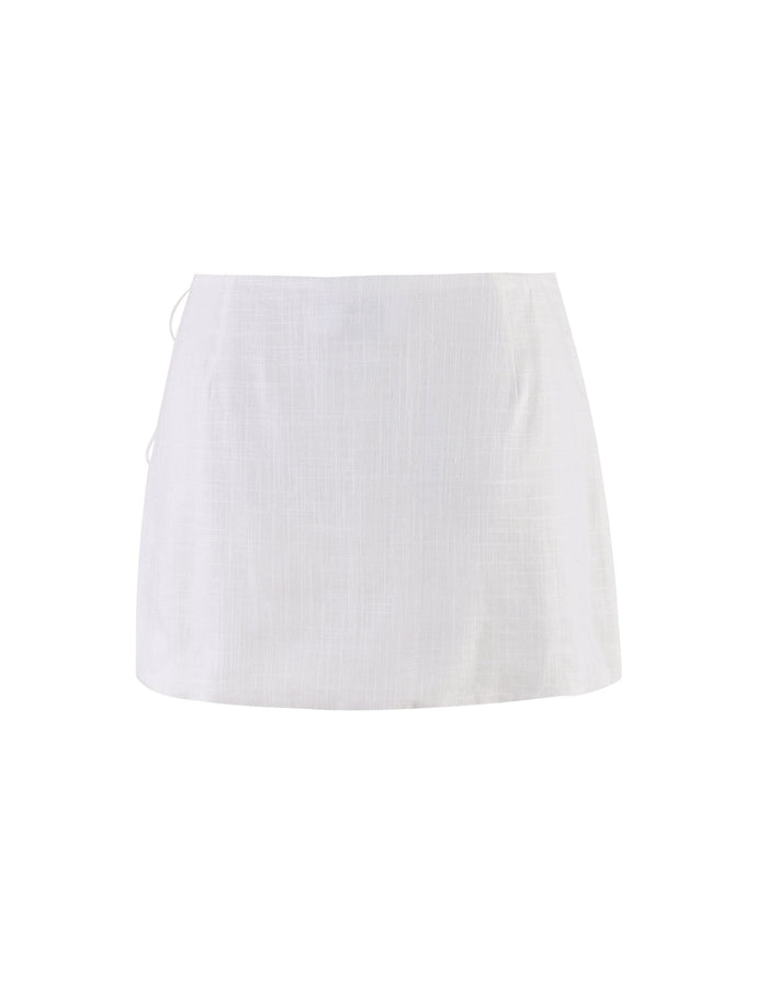 The NICOLA SKIRT - WHITE from TIGERMIST is displayed against a plain white background. Featuring a straight, simple design made of lightweight fabric, it has no visible embellishments or pockets, resulting in a clean, minimalist look.