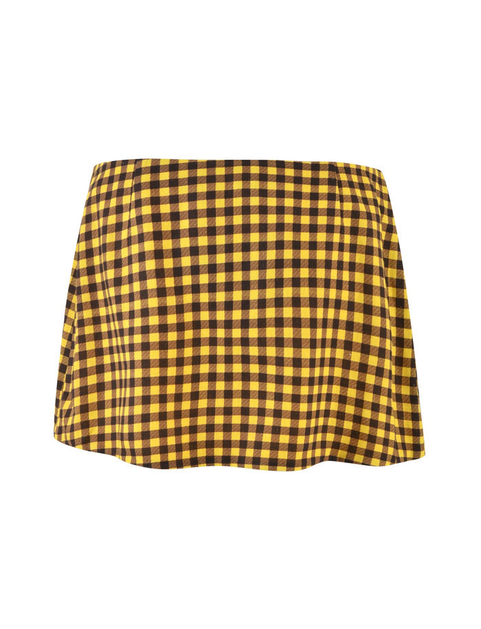 The NICOLA SKIRT - YELLOW : CHECK by TIGERMIST is a yellow and black plaid mini skirt. Its fabric features evenly spaced, alternating checkerboard squares that give it a bold, vibrant look. Displayed on a plain white background, the design and colors of the skirt are prominently highlighted.