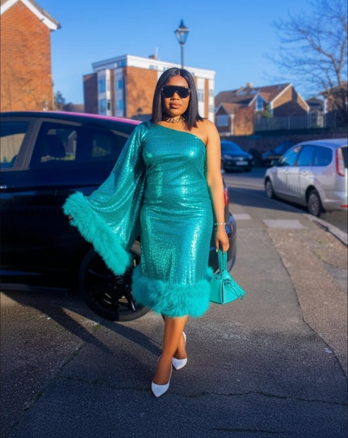 Woman wearing green one shoulder sequin dress with fur trim elegant party dress