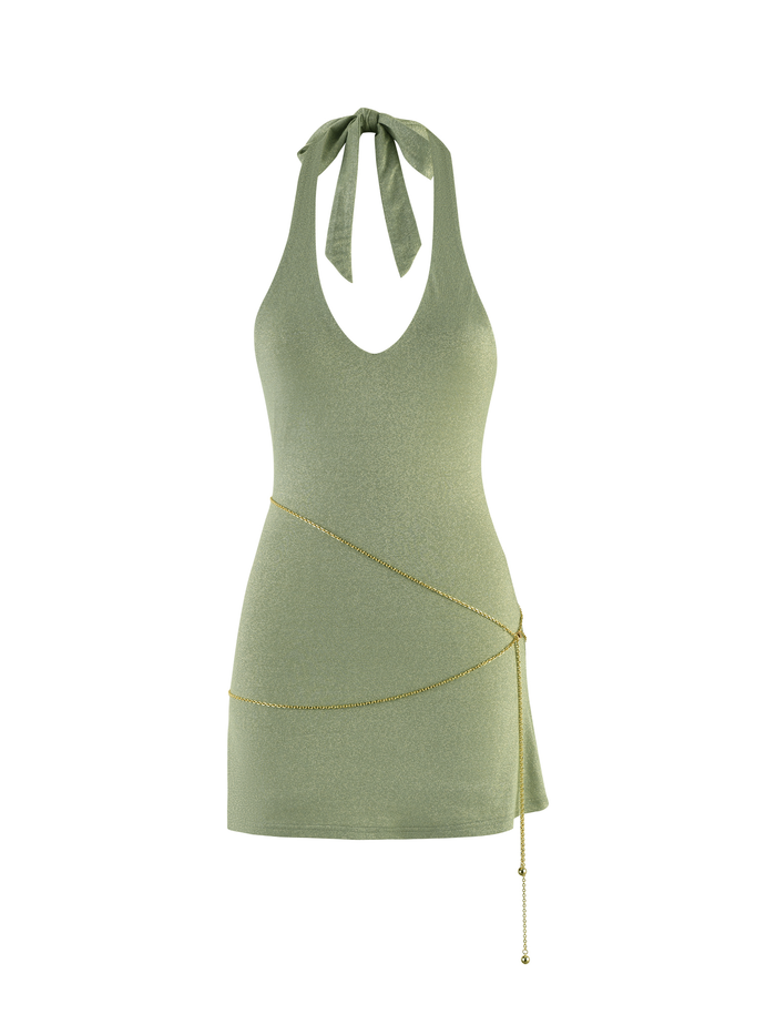 The OPELI DRESS - GREEN SPARKLE by TIGERMIST features a light green halter neck, deep V neckline, and sparkle fabric with a gold chain belt diagonally at the waist, shown on a plain white background.