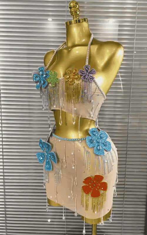 Shine in the Patti colorful rhinestone and pearl two-piece set with a sheer top and mini skirt. Perfect for parties, birthdays, and nightlife.