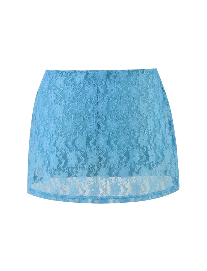 The QUINLEY SKORT - BLUE by TIGERMIST is beautifully showcased, featuring bright blue lace in an elegant ice blue shade. This high-waisted skort displays intricate floral lace detailing throughout and is slightly sheer due to the delicate material, giving it a light and graceful appearance perfect for a feminine and stylish look.