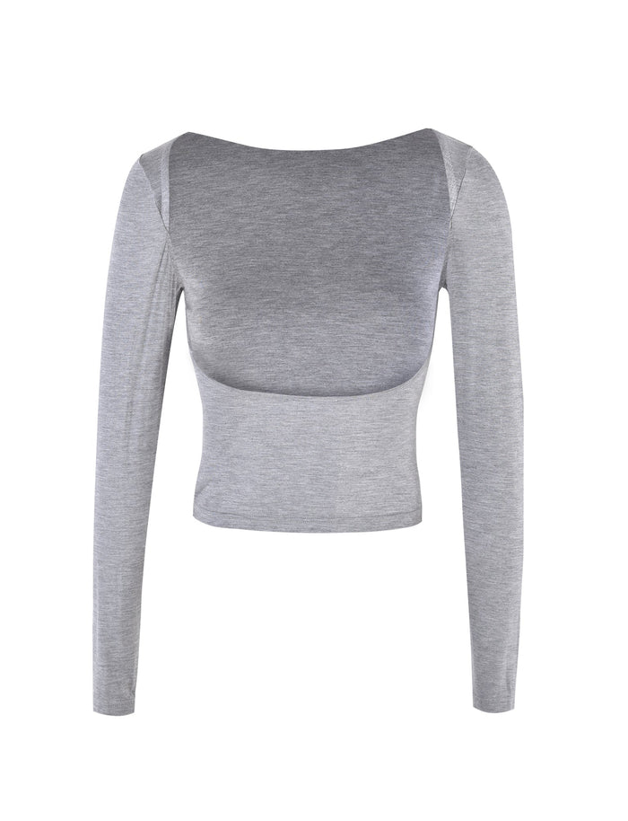 The QUINNELL TOP - GREY by TIGERMIST is a gray, long-sleeve crop top featuring a boat neckline. The front view reveals a soft, slightly stretchy fabric that offers a fitted silhouette.