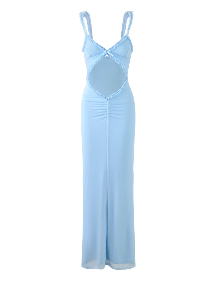 The RAYLA DRESS - BLUE from TIGERMIST is a pastel blue, sleeveless maxi dress with ruffled straps. It features a keyhole cutout in the front torso area and has slight ruching down the center. The fabric appears light and flowy, making it ideal for warm weather.