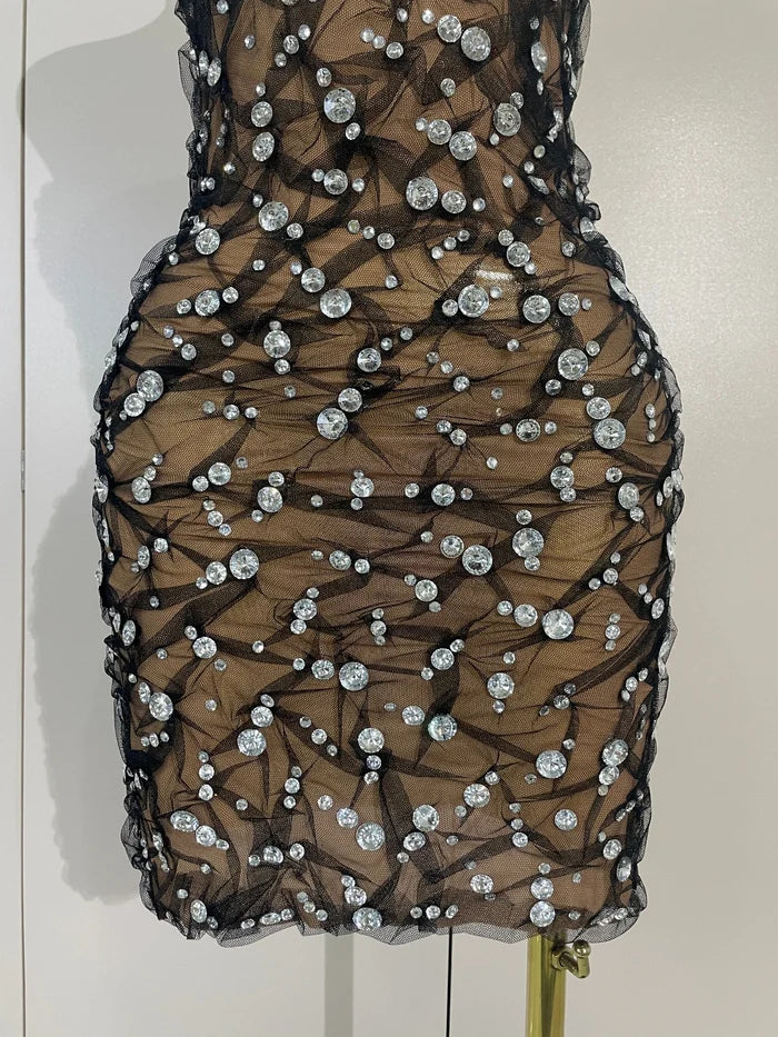 Reiley rhinestone strapless mesh see through mini dress for women. Sexy sparkly outfit for birthdays, nightlife, and parties.