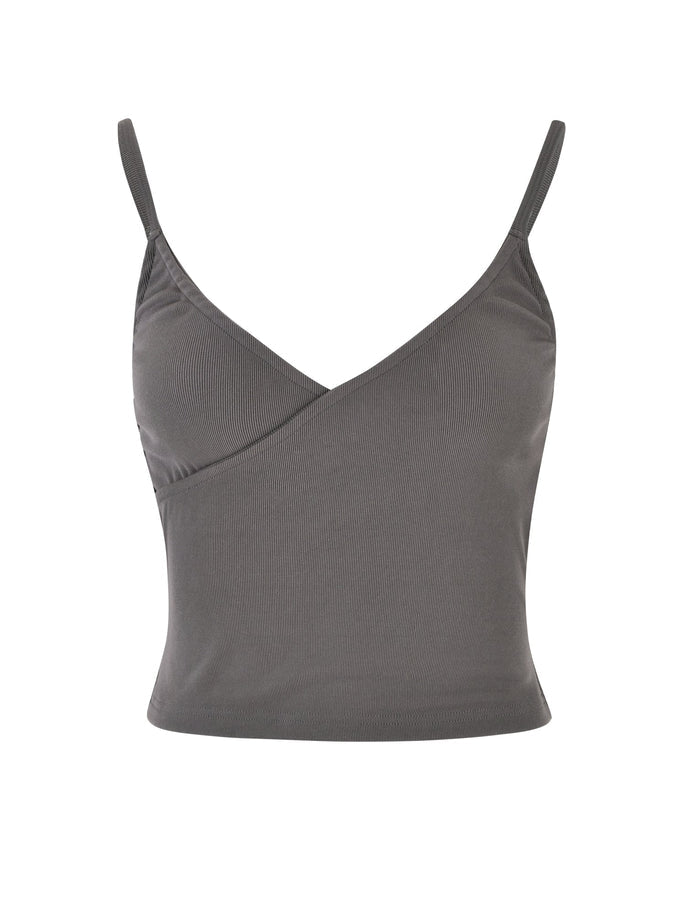The REY TOP - GREY : CHARCOAL by TIGERMIST is a gray, sleeveless camisole featuring spaghetti straps and a V-neckline. The fabric is soft and stretchable, with a subtle wrapped design on the front. This fitted top finishes at the waist.