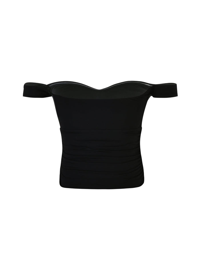 The SAFAA TOP - BLACK from TIGERMIST is a black off-shoulder crop top designed with short sleeves. The fabric appears soft and form-fitting, featuring subtle ruching on the sides for a textured look. It also has a sweetheart neckline, adding an elegant touch.